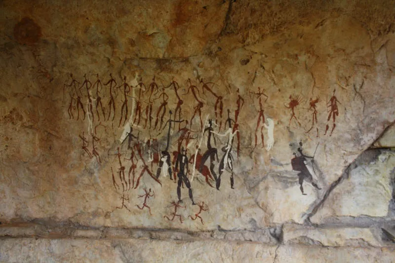 A number of ethereal figures are painted onto solid rock. The figures are mystical in nature. The are three different colors used,red, black an white. The figures depict a hunt